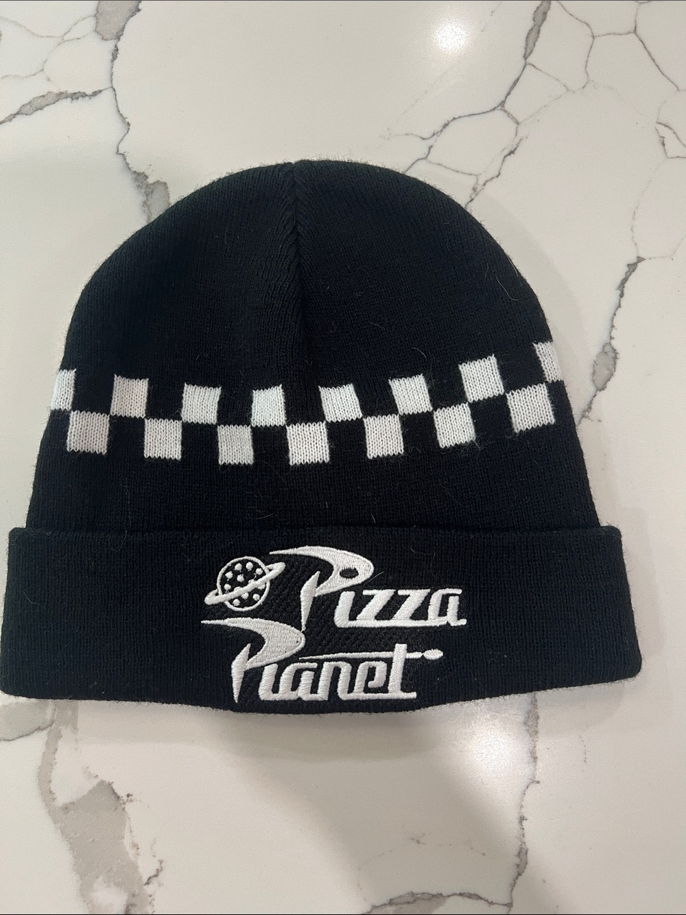 Pixar Pizza Planet checkered beanie hat